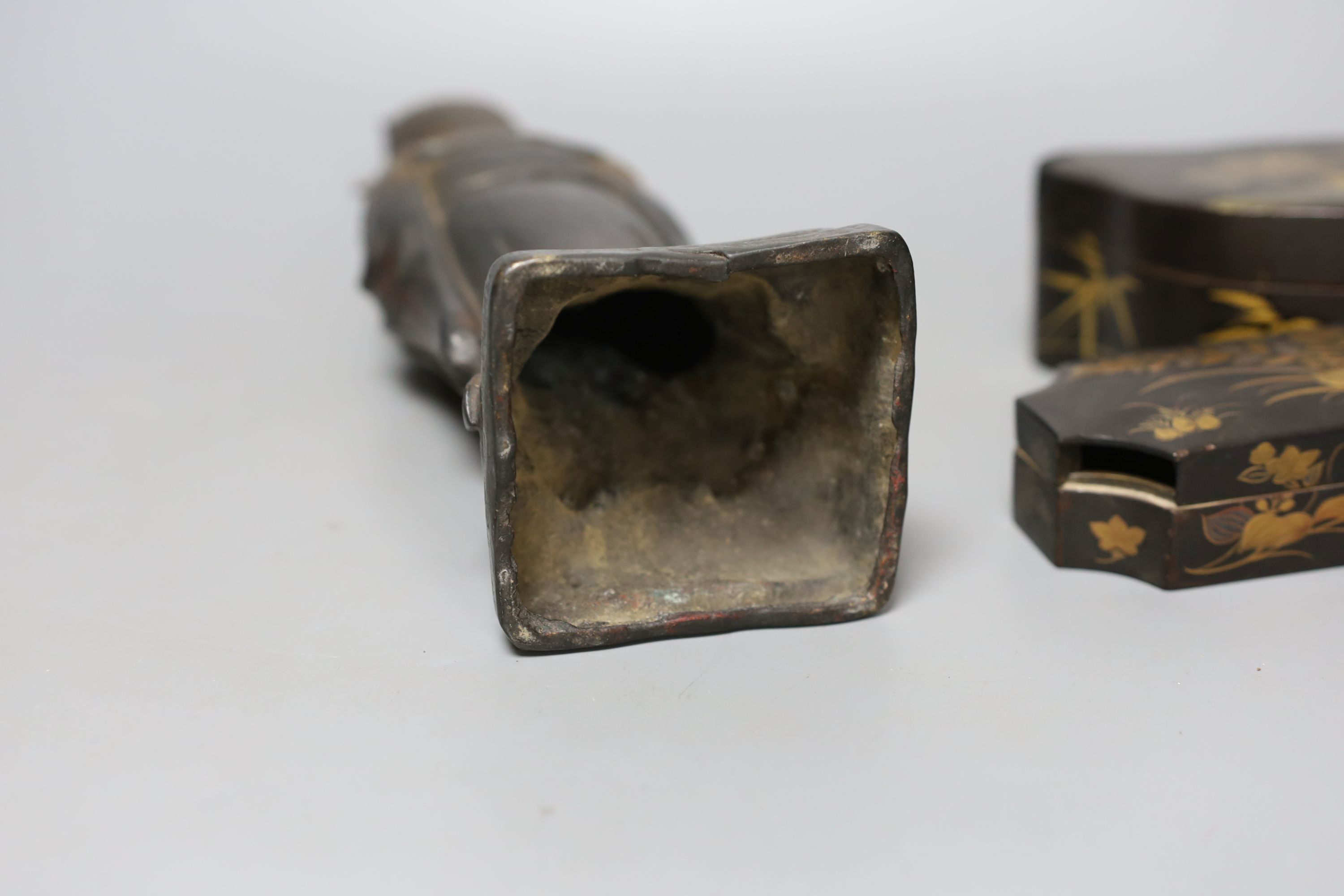 A Chinese bronze figure of an official and three Japanese lacquer boxes. Tallest 29cm